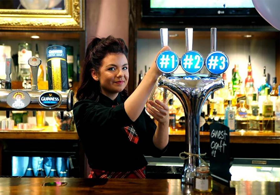 Girl pouring pint - Stonegate Group