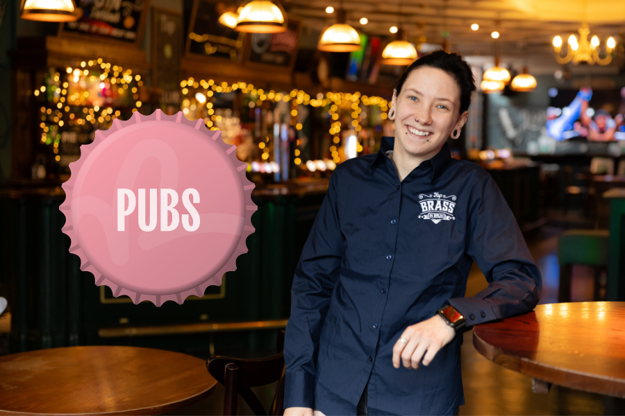 Pub worker leaning on table